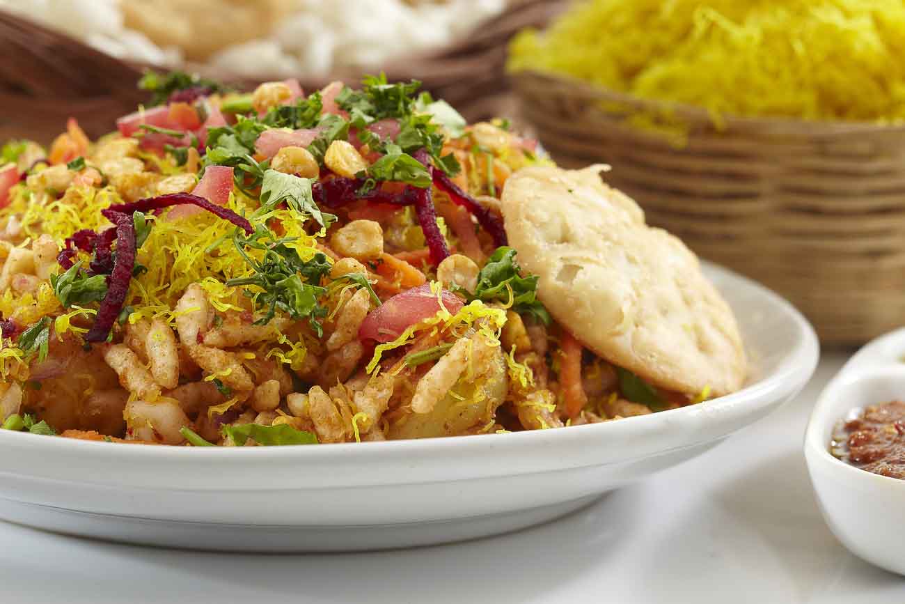 Mumbai bhel puri with puffed rice, chutneys, and sev